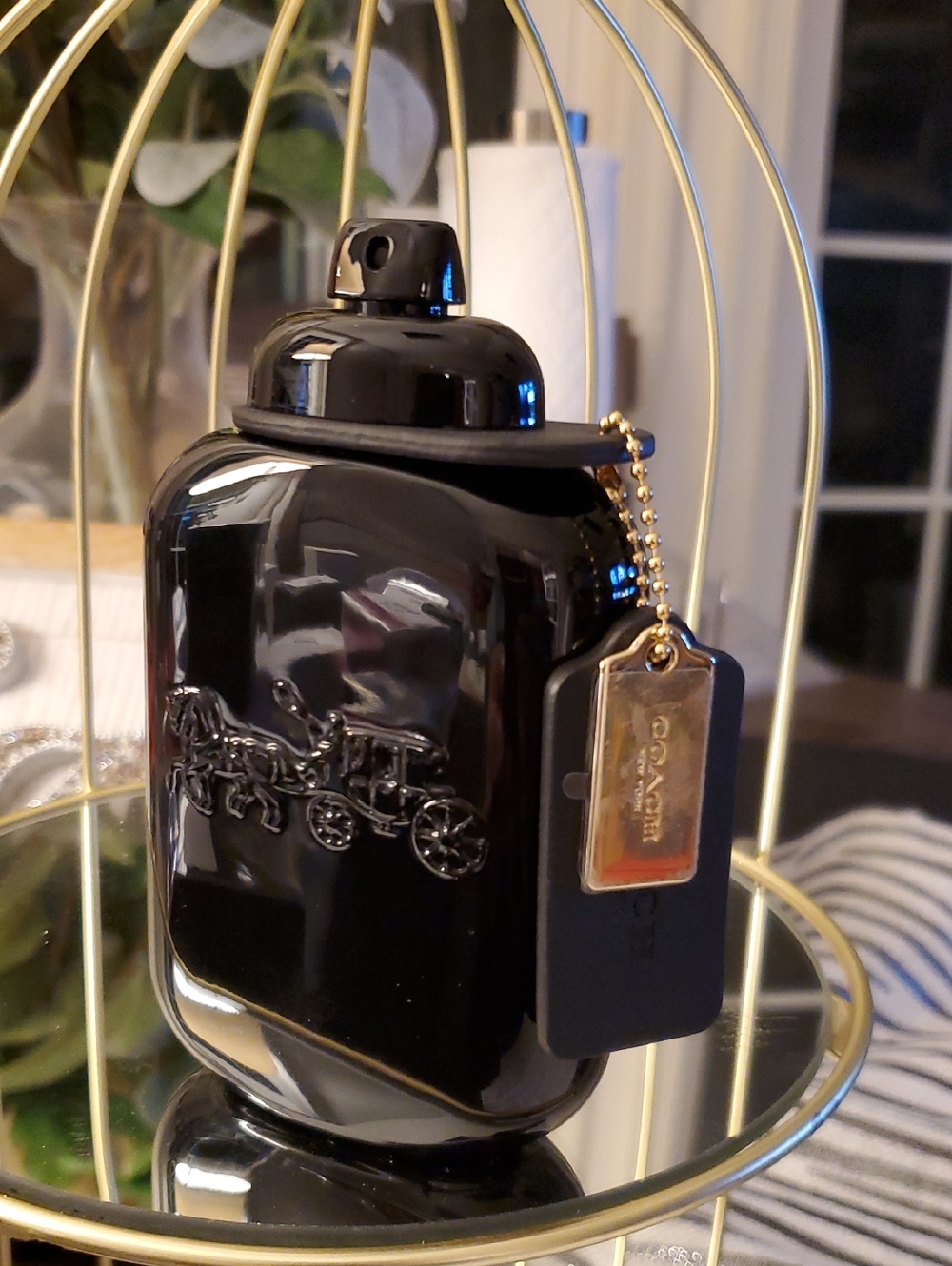 Coach Glossy Black Bottle with Gold Tag